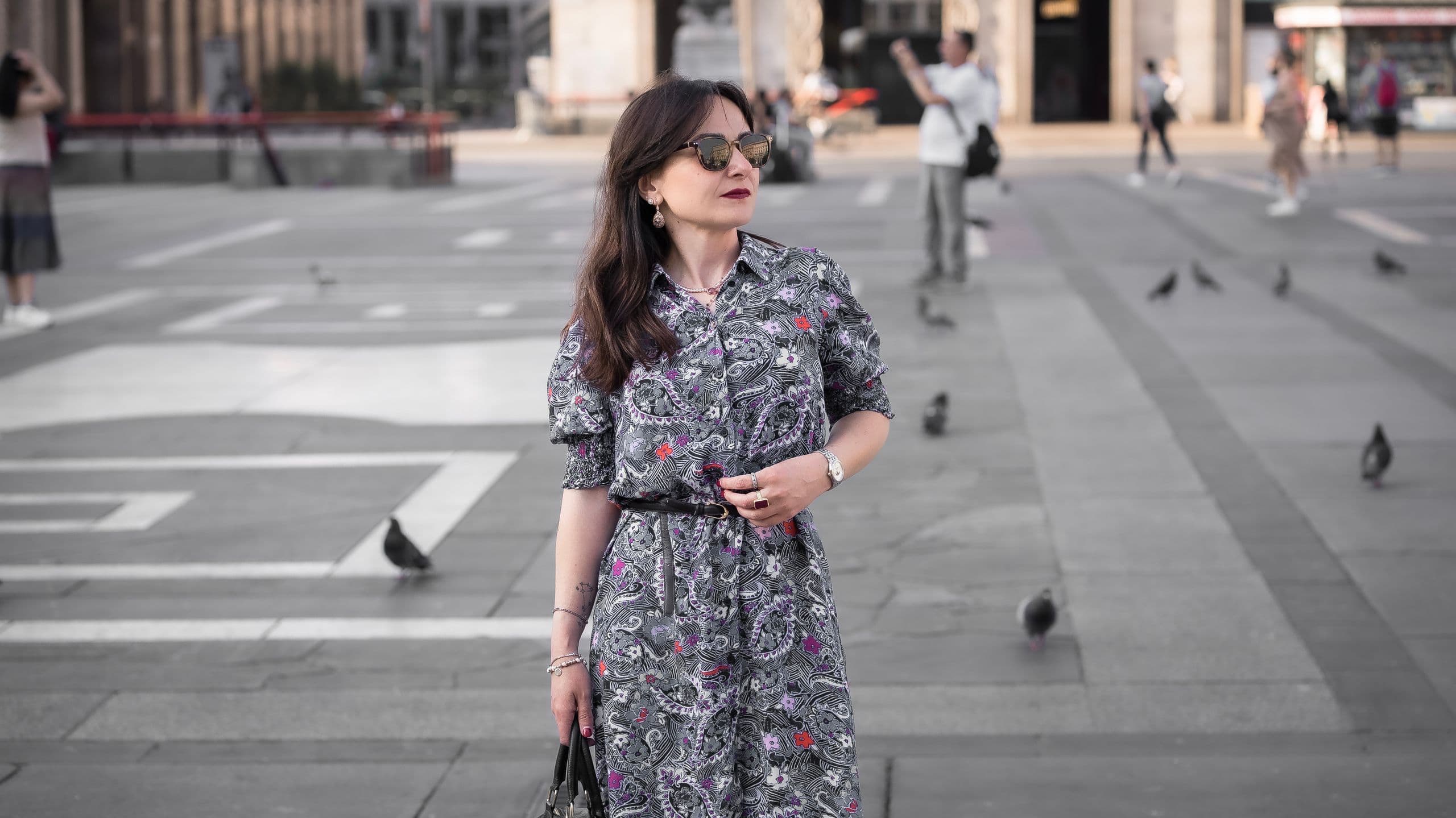 MAKU campaign — woman in an original-print dress in a Milan piazza, Italian editorial photography